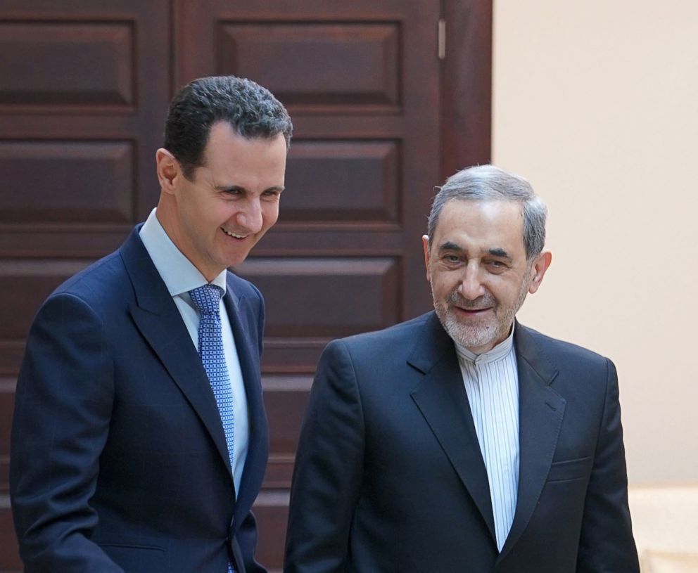 PHOTO: Syrian President Bashar Assad (L) receiving Ali Akbar Velayati (R), a top adviser to Iran's Supreme Leader Ayatollah Ali Khamenei, in Damascus, Syria, April 12, 2018. 