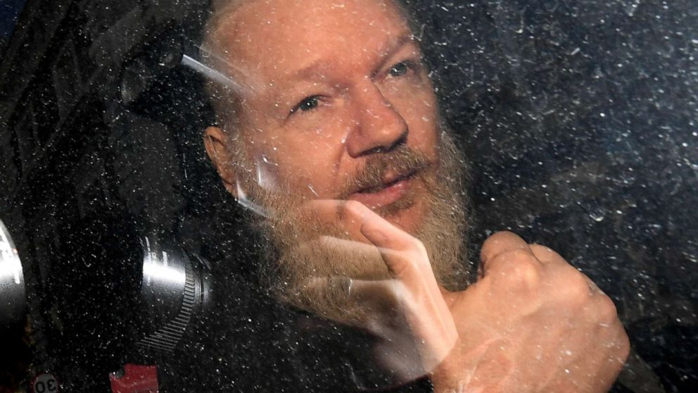 PHOTO: Julian Assange gestures as he arrives at Westminster Magistrates' Court in London, after the WikiLeaks founder was arrested by officers from the Metropolitan Police, April 11, 2019.