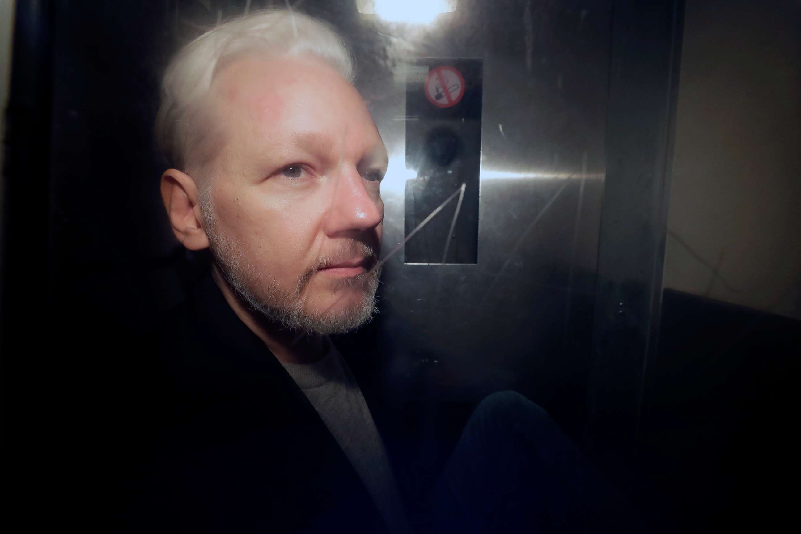 PHOTO:WikiLeaks founder Julian Assange being taken from court, where he appeared on charges of jumping British bail seven years ago, in London,  May 1, 2019.
