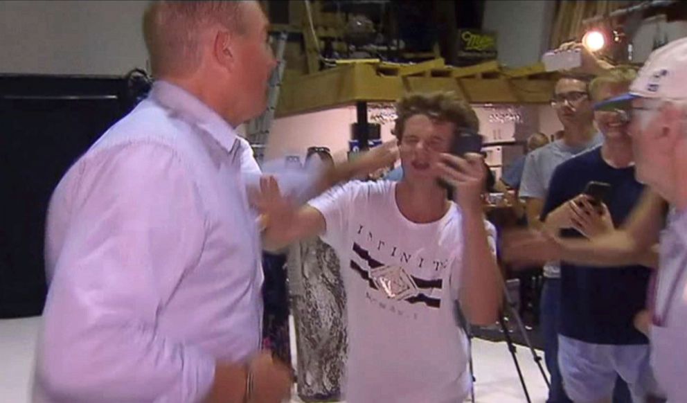 PHOTO: Senator Fraser Anning swipes at a teenager who broke an egg on his head while he was holding a press conference, March 16, 2019, in Melbourne, Australia.