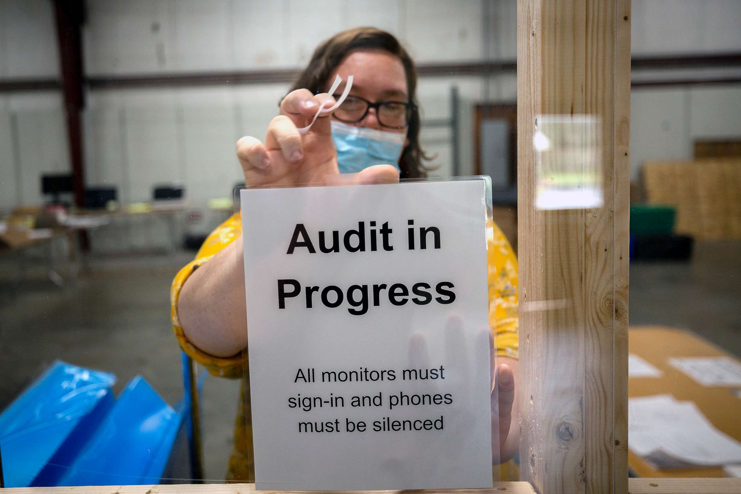 PHOTO:A Chatham County election official posts a sign in the public viewing area before the start of a ballot audit, Nov. 13, 2020, in Savannah, Ga