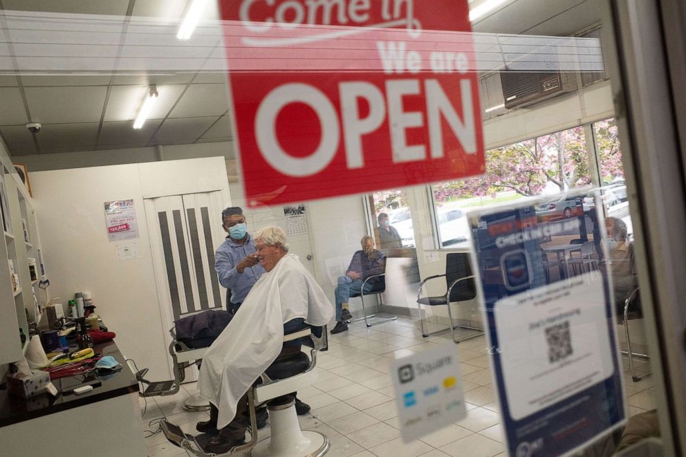 PHOTO: A customer receives a hair cut at Jina's Hair Dressing in Canberra, Australia, Oct. 15, 2021. 