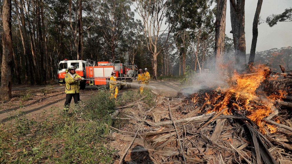PHOTO: Firefighters battles a fire near Bendalong, Australia, Jan. 3, 2020.