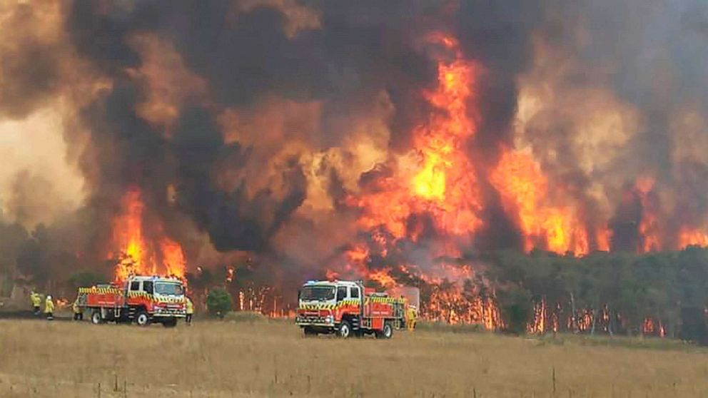 PHOTO: A handout photo taken Dec. 31, 2019, by the New South Wales Rural Fire Service (RFS) shows firefighters tackling a blaze at Charmhaven on the Central Coast, Australia.