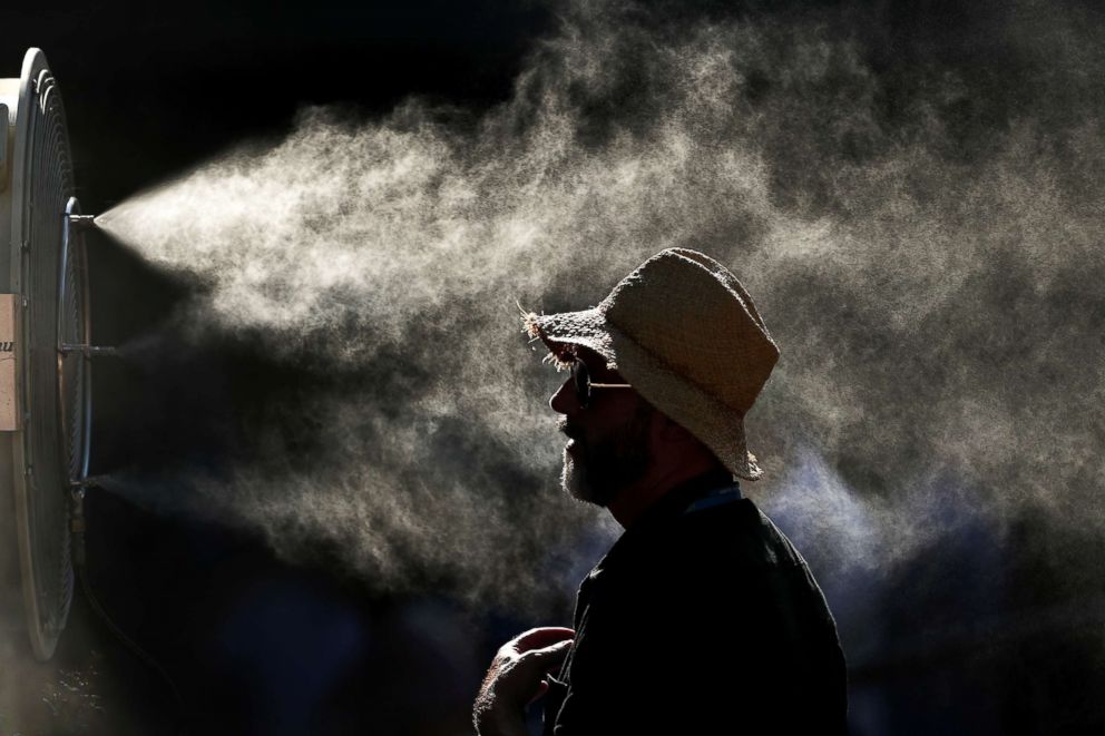 PHOTO: Fans cool off in the hot conditions at the 2019 Australian Open on Jan. 24, 2019, in Melbourne.