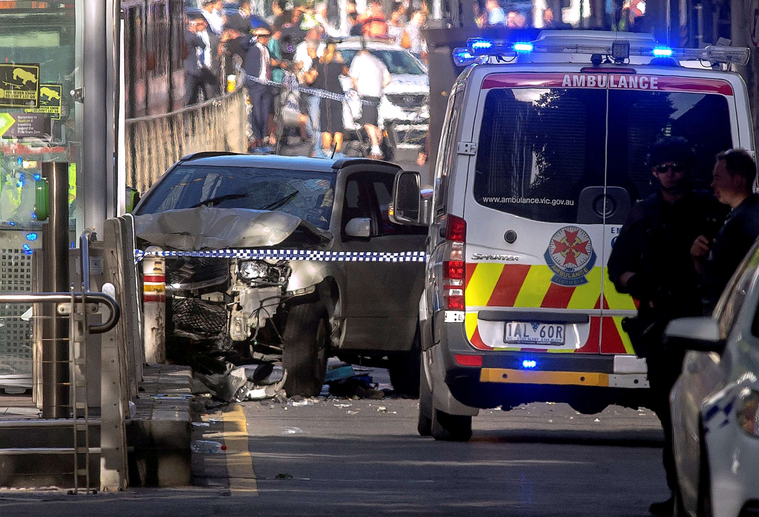 PHOTO: Australian police stand near a crashed vehicle after they arrested the driver of a vehicle that had rammed into pedestrians at a crowded intersection near the Flinders Street train station in central Melbourne, Australia, Dec. 21, 2017. 
