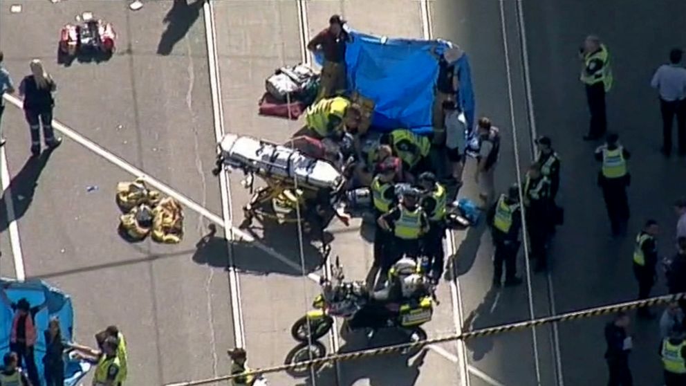 PHOTO: Police and emergency services attend to the scene of an incident involving a vehicle on Flinders Street, as seen from Swanson Street, in Melbourne, Australia, Dec. 21, 2017. 