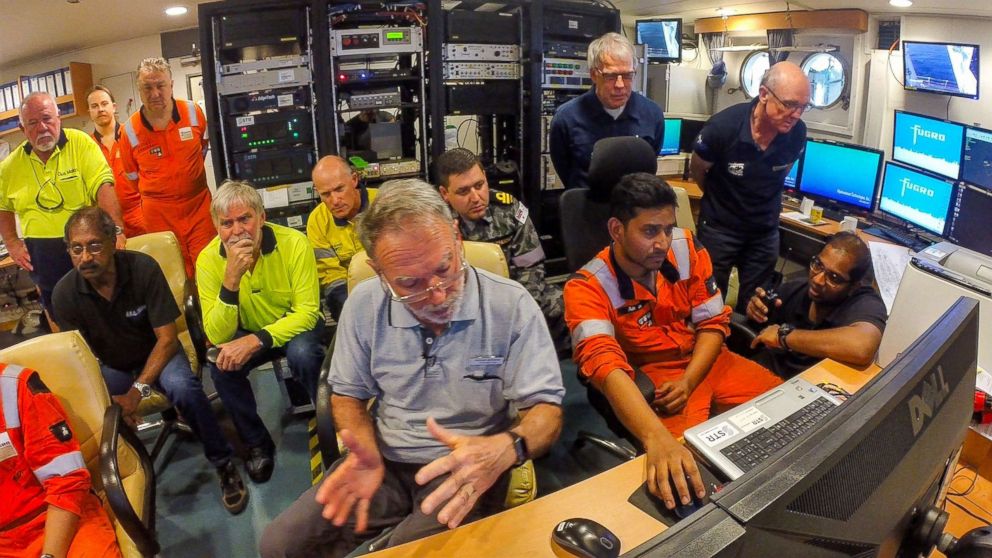 PHOTO: Members of the Find AE1 survey team are shown analysing the drop camera vision of the wreckage of Australian submarine HMAS AE1 in this handout photo provided by the Royal Australian Navy. 