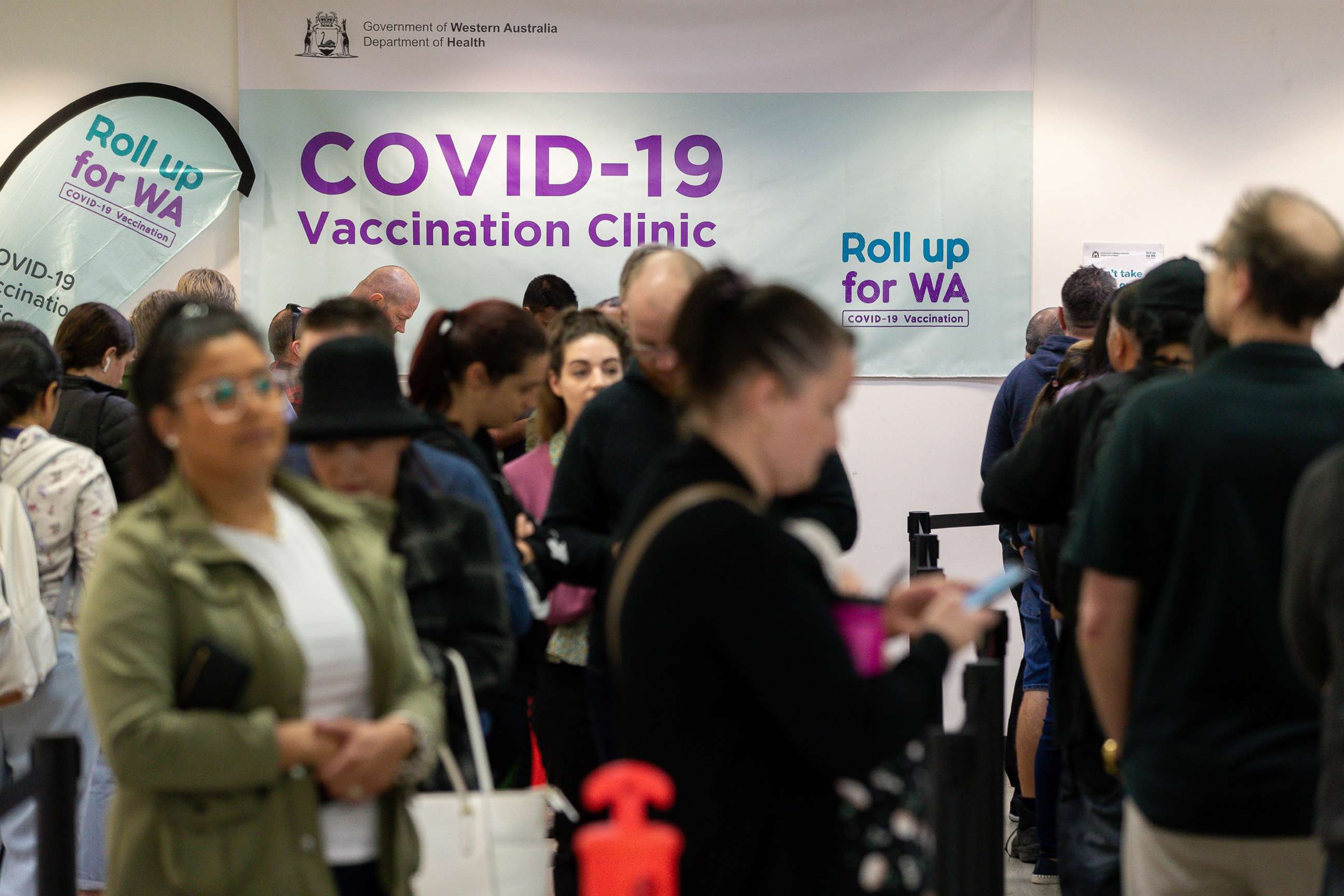 PHOTO: Members of the public wait in line at a COVID-19 mass vaccination clinic in Midland, an eastern suburb of Perth, Australia, Sept. 9, 2021.