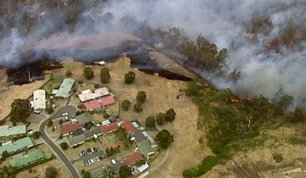 PHOTO: In this image made from video, an aerial scene shows fires burning and smoke rising close to properties in Bundoora, Victoria state, Dec. 30, 2019.