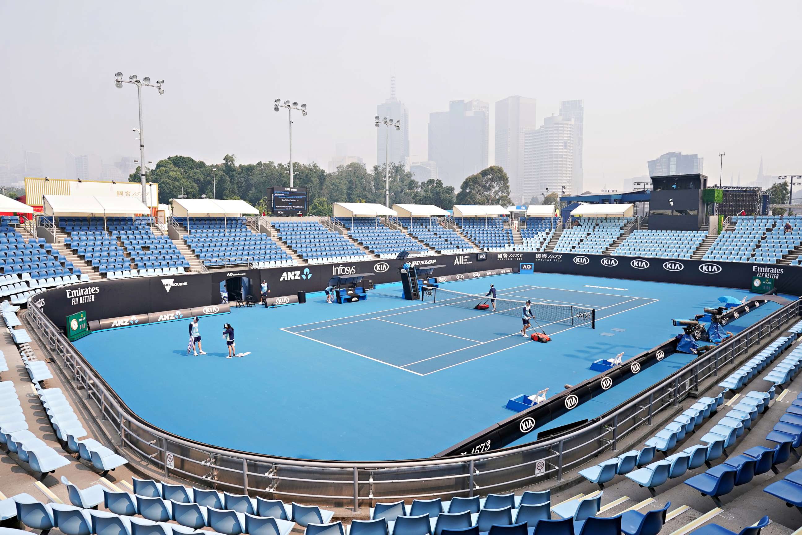PHOTO: The city skyline is shrouded by smoke haze from bushfires during an Australian Open practice session at Melbourne Park in Melbourne, Australia on Jan. 14, 2020.  
