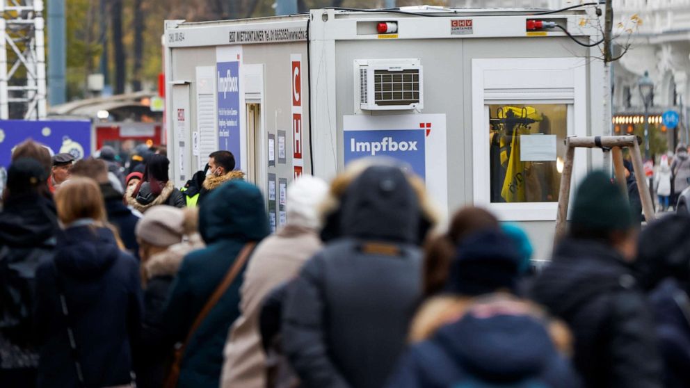 PHOTO: People wait in front of a COVID-19 vaccination point in Vienna, Austria, on Nov. 14, 2021, as the Austrian government announces a lockdown on residents who are not fully vaccinated.