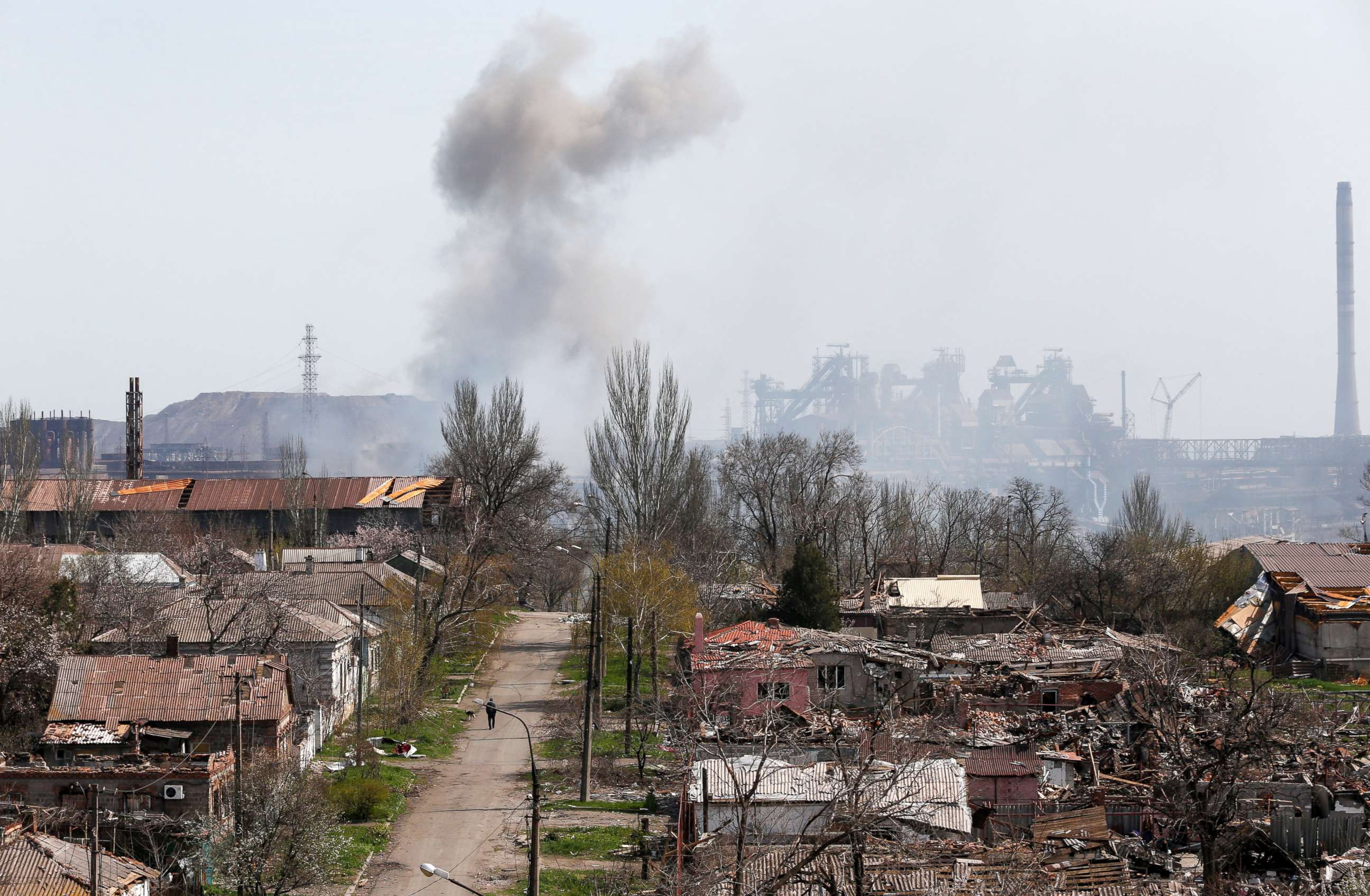 PHOTO: Smoke rises above a plant of Azovstal Iron and Steel Works company and buildings damaged in the southeastern port city of Mariupol, Ukraine, April 18, 2022, amid Russia's invasion.