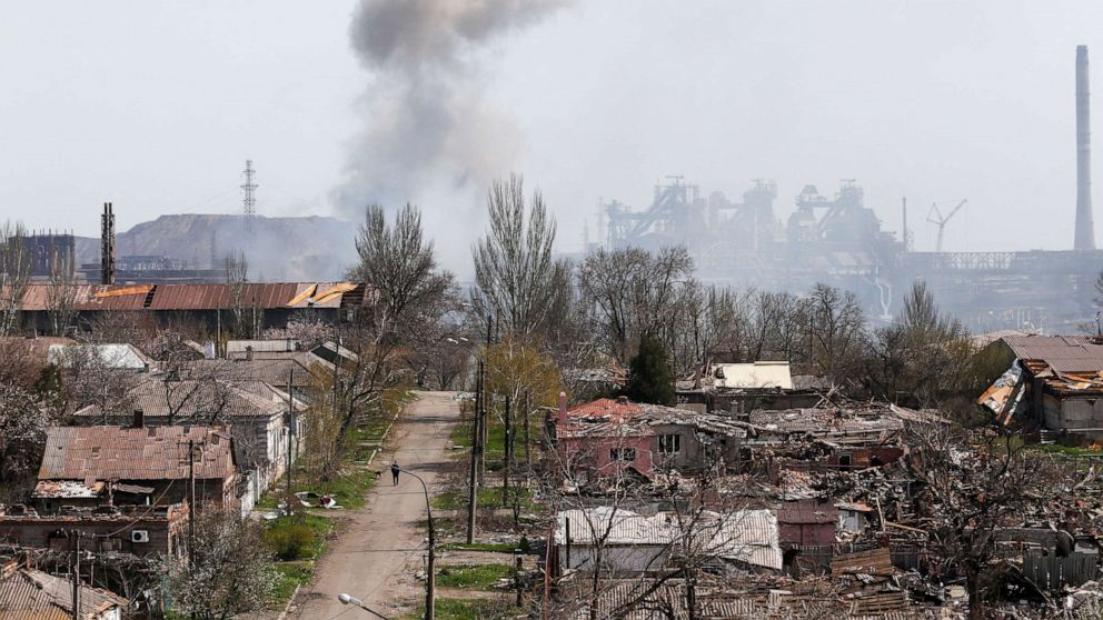 PHOTO: Smoke rises above a plant of Azovstal Iron and Steel Works company and buildings damaged in the southeastern port city of Mariupol, Ukraine, April 18, 2022, amid Russia's invasion.