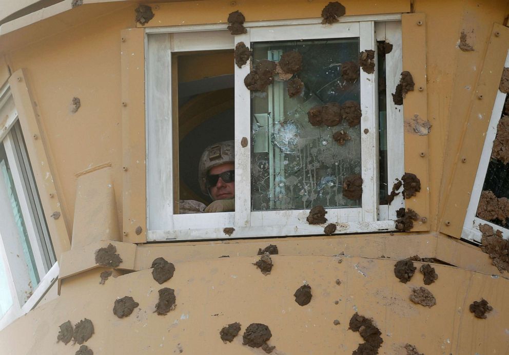 PHOTO: A U.S. Army soldier is seen at a watchtower of the U.S. Embassy during a protest to condemn air strikes on bases, in Baghdad, Jan. 1, 2020.