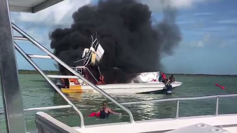 People on a neighboring boat attempted to rescue injured passengers from the explosion off Exuma in the Bahamas on Saturday, June 30, 2018.