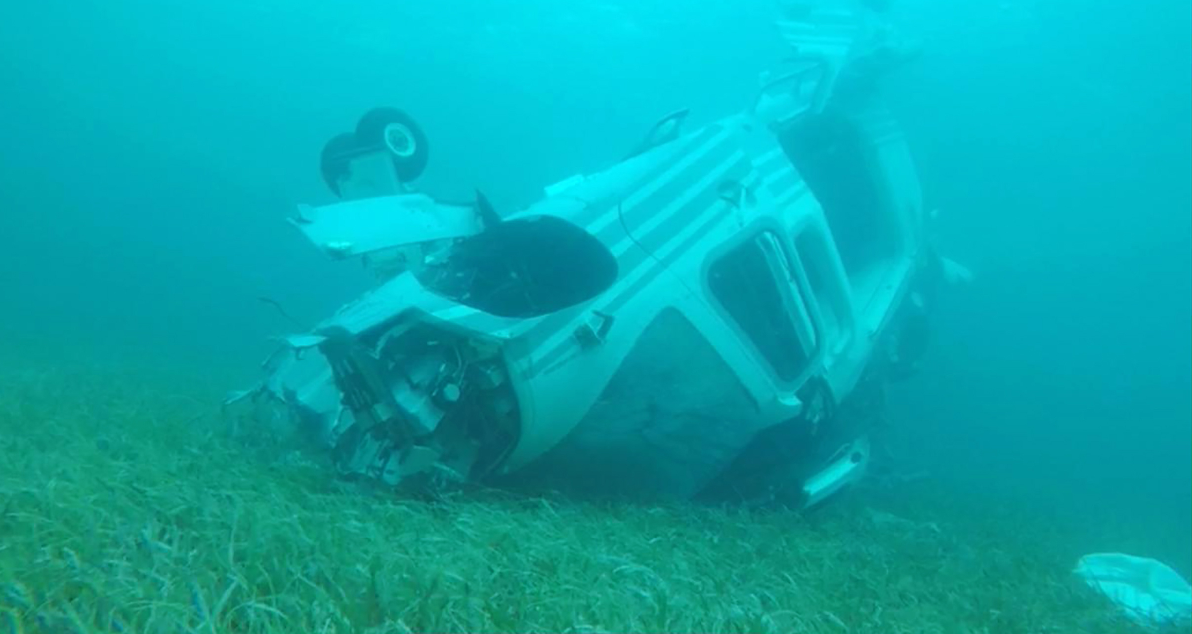 PHOTO: Investigators conducted underwater surveying and mapped the debris field at the scene of a helicopter crash off Grand Cay, in the Bahamas, on July 5, 2019.