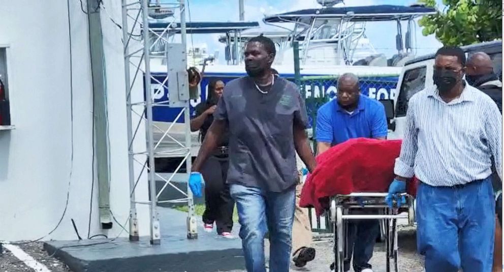 PHOTO: The body of a migrant who died after their vessel capsized off the coast of The Bahamas is taken away by mortuary workers in Nassau, Bahamas July 24, 2022