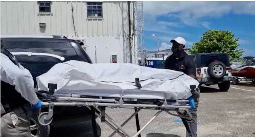 PHOTO: The body of a migrant who died after their vessel capsized off the coast of The Bahamas is taken away by mortuary workers in Nassau, Bahamas July 24, 2022.