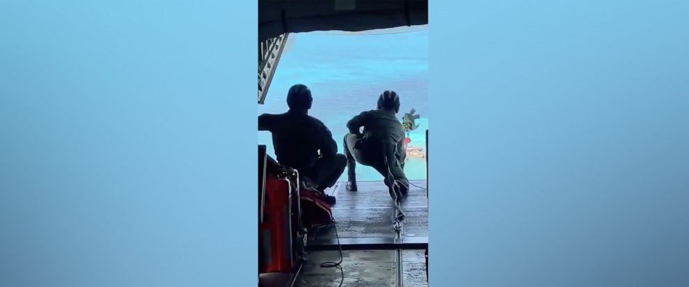 PHOTO: A U.S. Coast Guard aircrew drops food, water and a radio to people stranded on Anguilla Cay, Feb. 8, 2021.