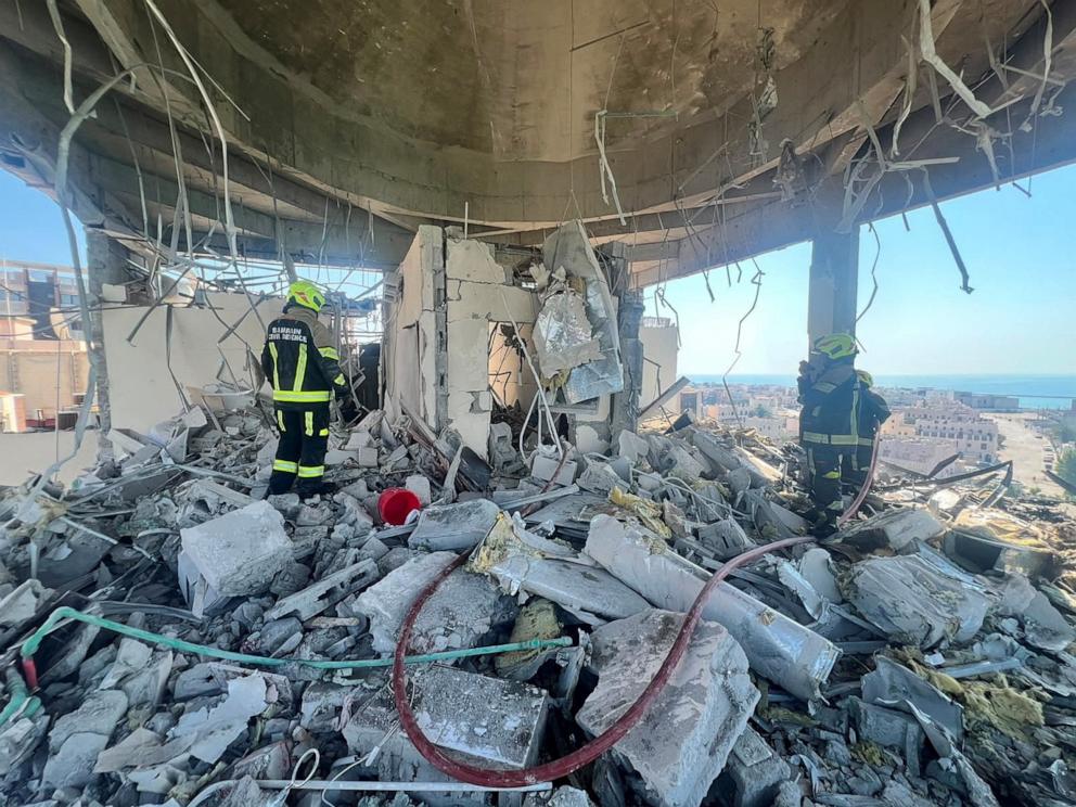 PHOTO: Bahrain civil defence and rescue personnel work in a residential building, which according to the Bahraini Interior Ministry, was hit by an Iranian drone, in Muharraq, Bahrain, June 28, 2026.