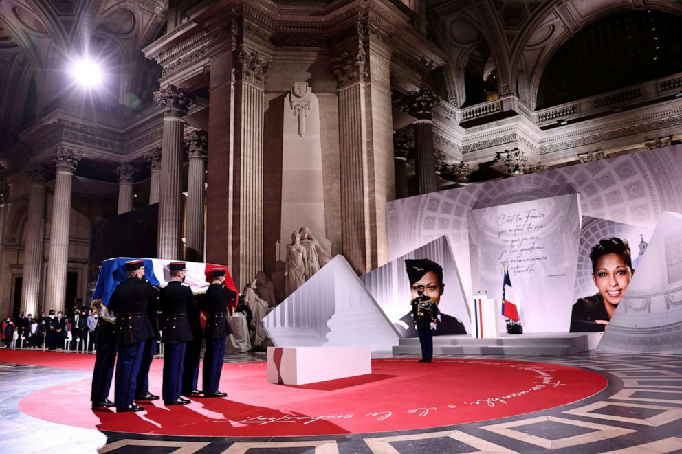PHOTO: Soldiers carry the cenotaph containing soil from various places where famed Black French-American singer and dancer Josephine Baker lived, covered with a French flag, during her induction ceremony into the Pantheon, in Paris, Nov. 30, 2021.