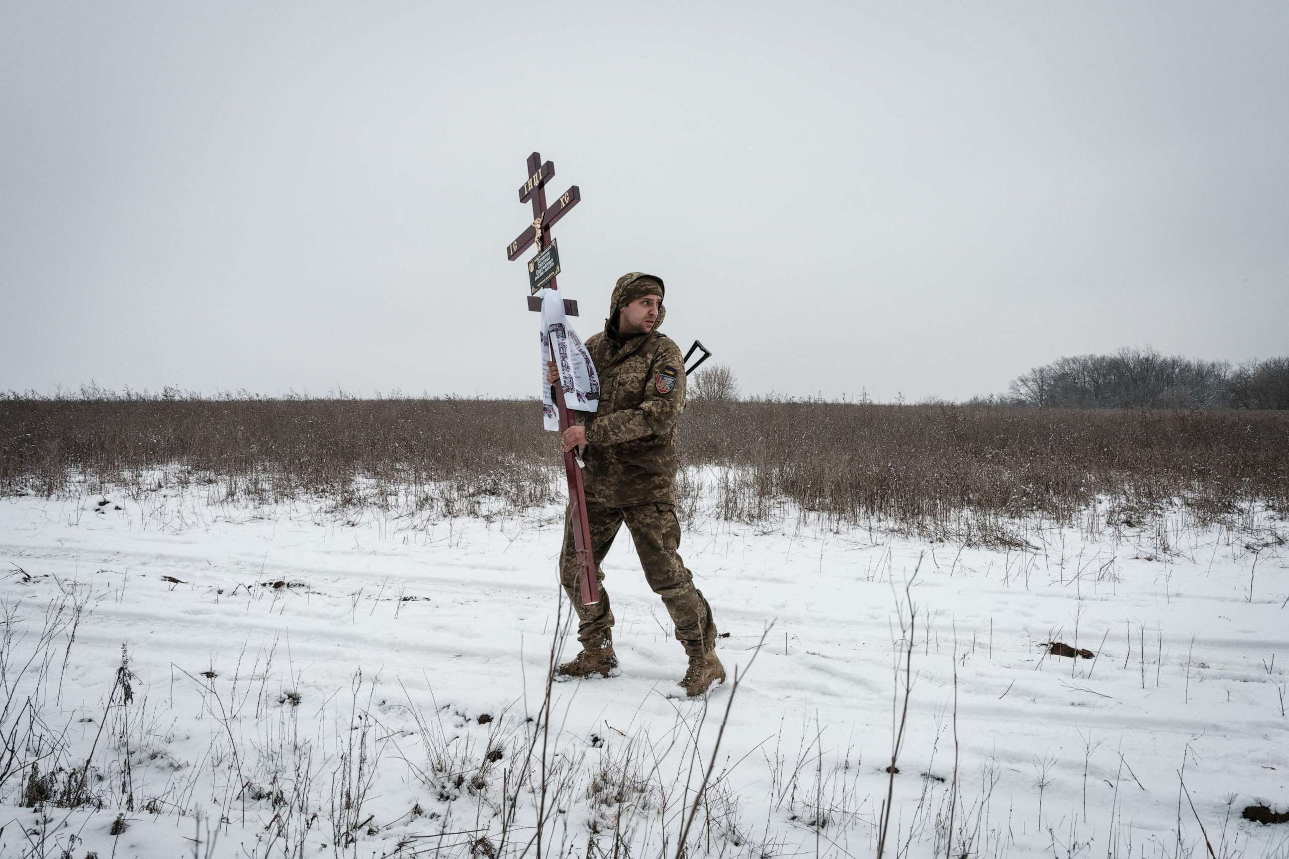 PHOTO: Oleksiy Storozh, 28, carries a cross i n Sloviansk, on Jan. 30, 2023, to be placed at the grave of his late best friend, Oleksandr Korovniy, 28, a Ukrainian serviceman of the Azov battalion killed in action in Bakhmut.