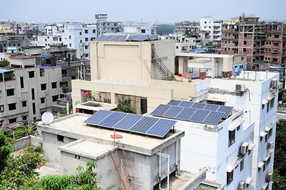 PHOTO: Solar energy panels are being seen on the rooftops of a high-rise residential building in Dhaka, Bangladesh, on April 19, 2024. 