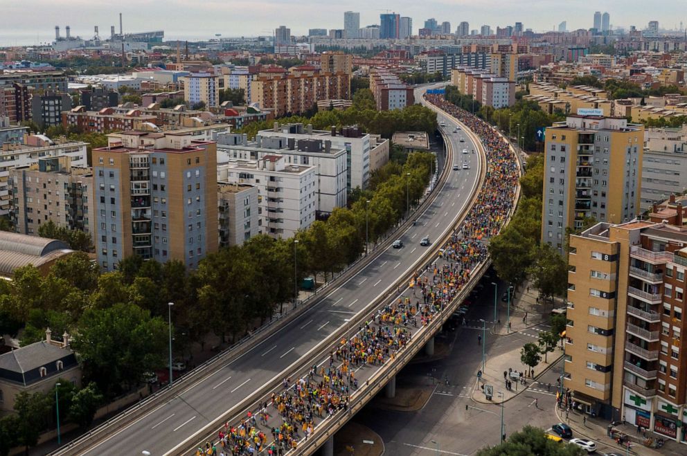 PHOTO: Pro-independence demonstrators march into the city on the fifth day of protests in Barcelona, Spain, Friday, Oct. 18, 2019.