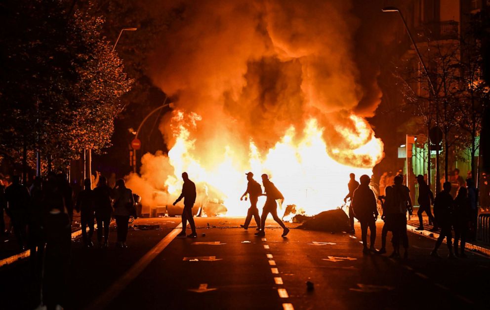 PHOTO: Fires burn following an evening of rioting as a general strike is called after a week of protests over the jail sentences given to separatist politicians by Spain's Supreme Court, on October 18, 2019 in Barcelona, Spain.
