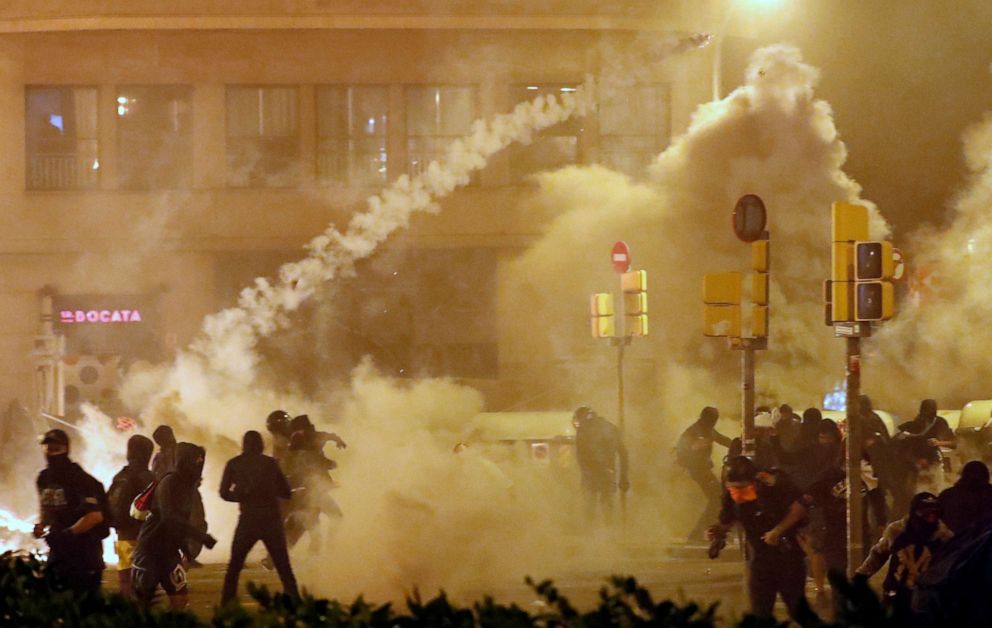 Barcelona Spain Riots A tourist walks to barcelona's cruise terminal