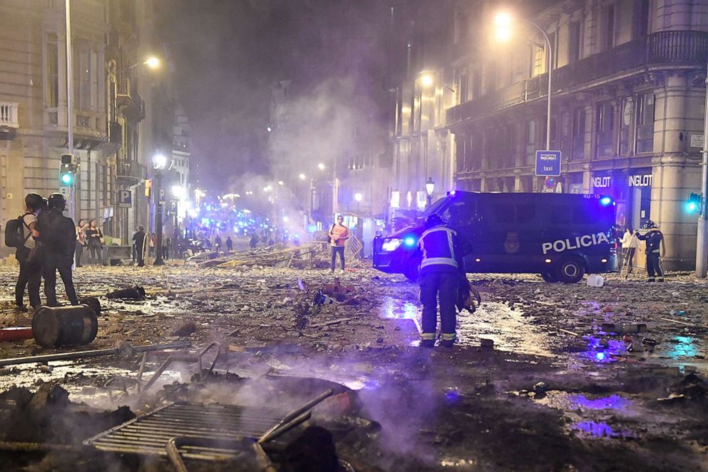 PHOTO: Burned debris are pictured in Barcelona, on October 18, 2019, after violence escalated during clashes, with radical separatists hurling projectiles at police, who responded with teargas and rubber bullets sparking scenes of chaos.