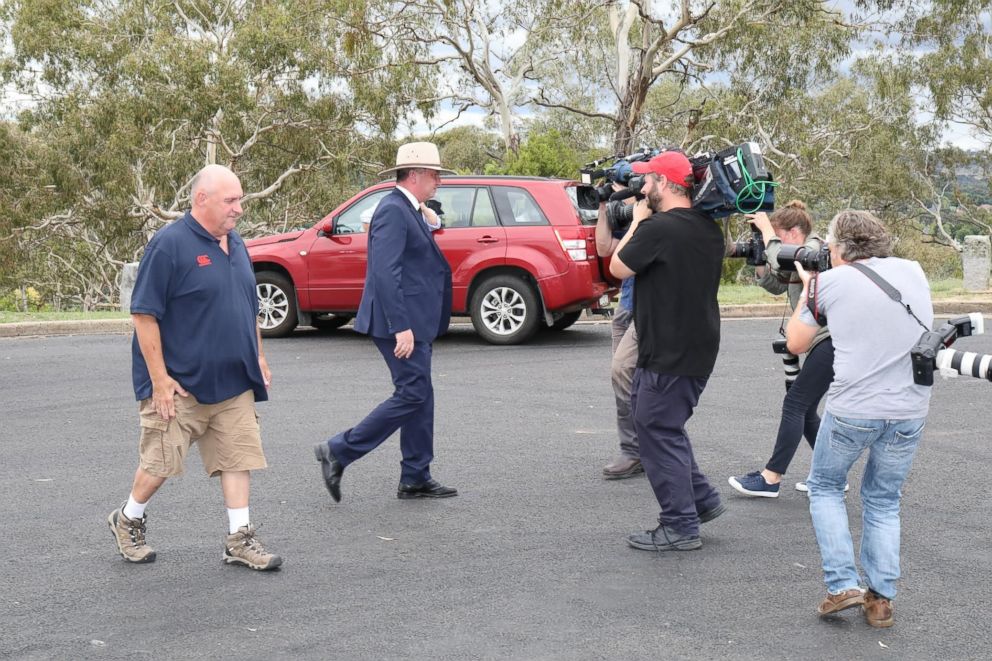 PHOTO: Australian Deputy Prime Minister Barnaby Joyce departs a press conference where he resigned as leader of his political party in Armidale, New South Wales, Australia, Feb. 23, 2018.
