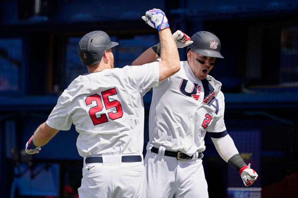 PHOTO: United States' Tyler Austin celebrates his home run with teammate Todd Frazier (25) in the fifth inning of a baseball game against the Dominican Republic at the 2020 Summer Olympics, Aug. 4, 2021, in Yokohama, Japan.