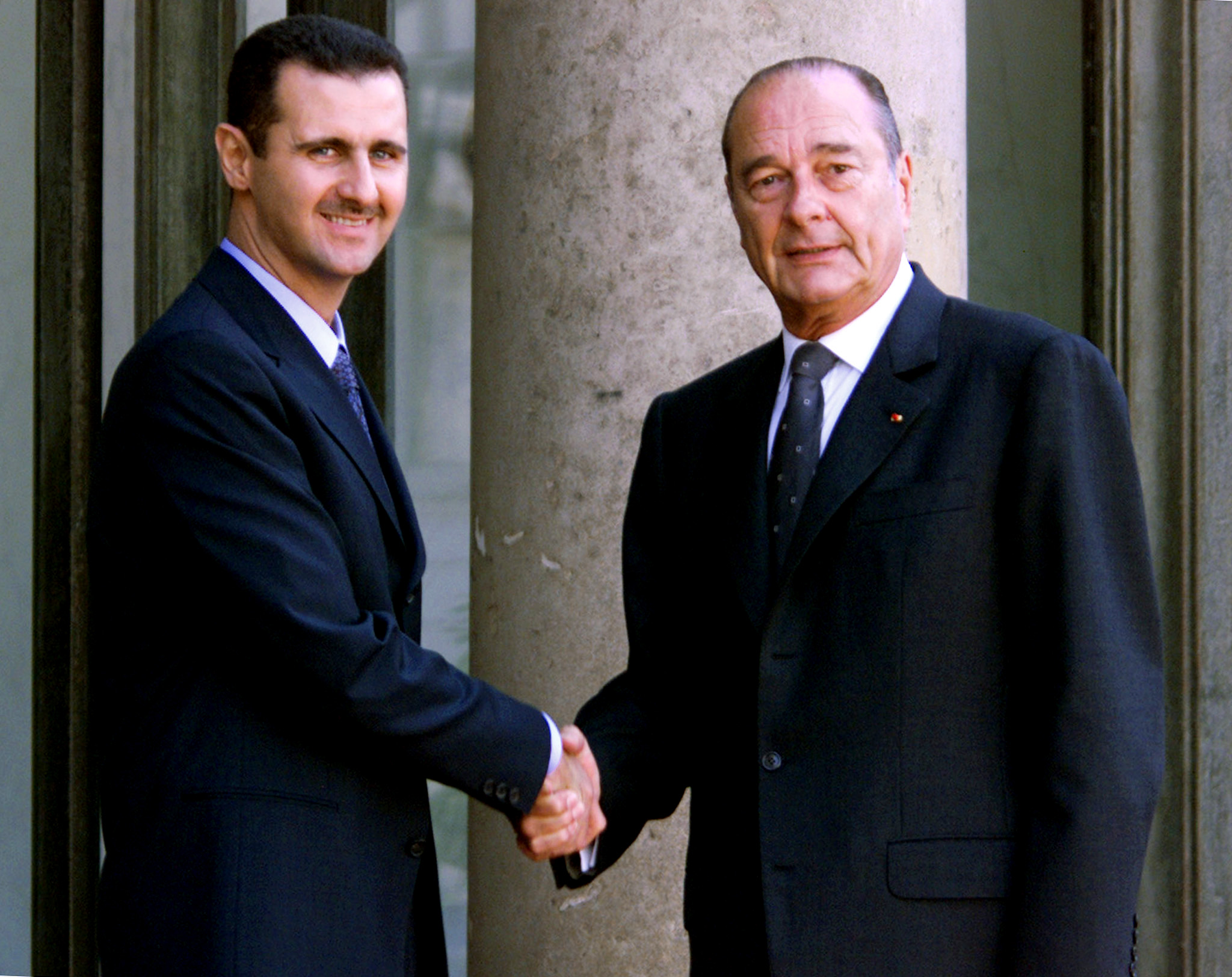PHOTO:  In this file photo taken on June 25, 2001 Syrian President Bashar al-Assad is greeted by French President Jacques Chirac before their meeting at the Elysee Palace in Paris.
