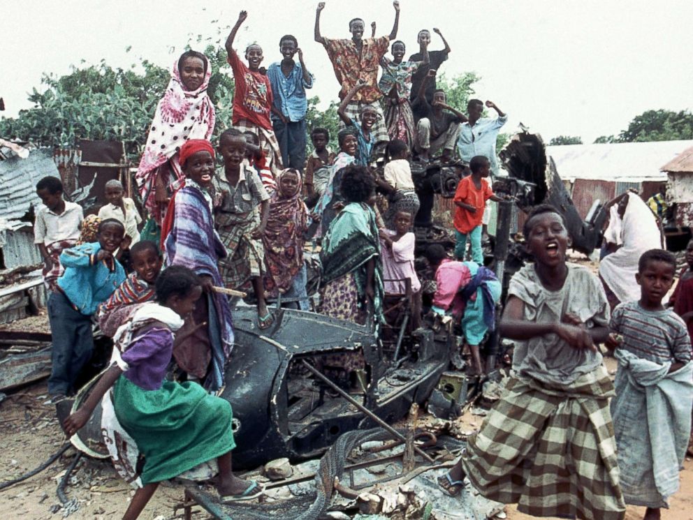 PHOTO: A group of young Somalis chant anti American slogans while sitting atop the burned out hulk of a U.S. Black Hawk helicopter in Mogadishu, Somalia, Oct. 19, 1993.