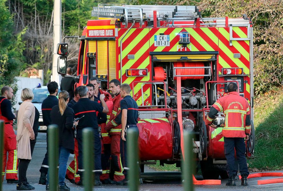 PHOTO: Local residents and firemen stand next to a fire truck after an incident at a mosque in Bayonne, southwestern France, Oct. 28, 2019.