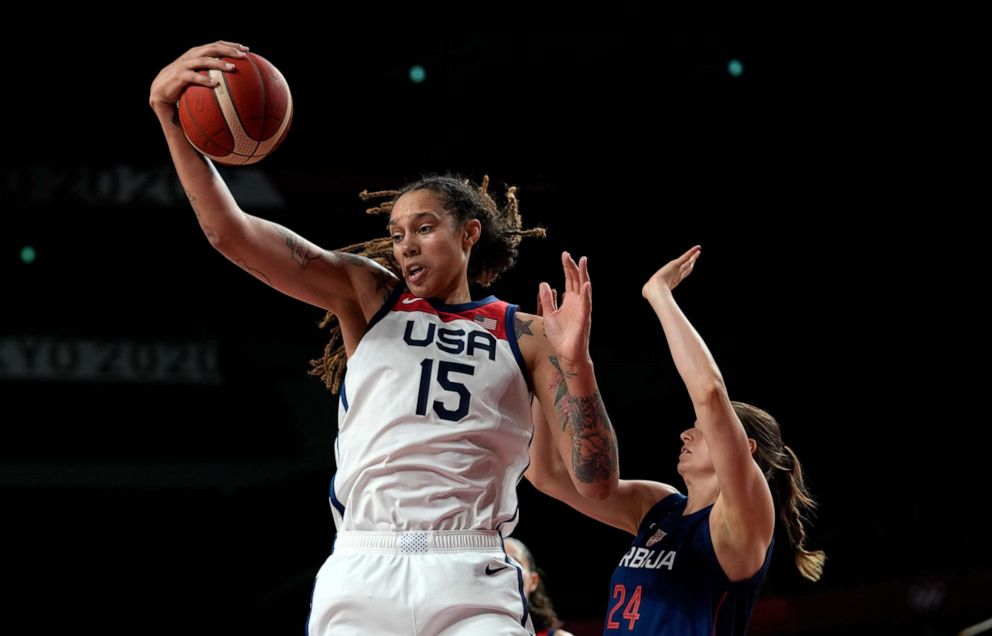 PHOTO: United States' Brittney Griner grabs a rebound ahead of Serbia's Maja Skoric during women's basketball semifinal game at the 2020 Summer Olympics, Aug. 6, 2021, in Saitama, Japan.