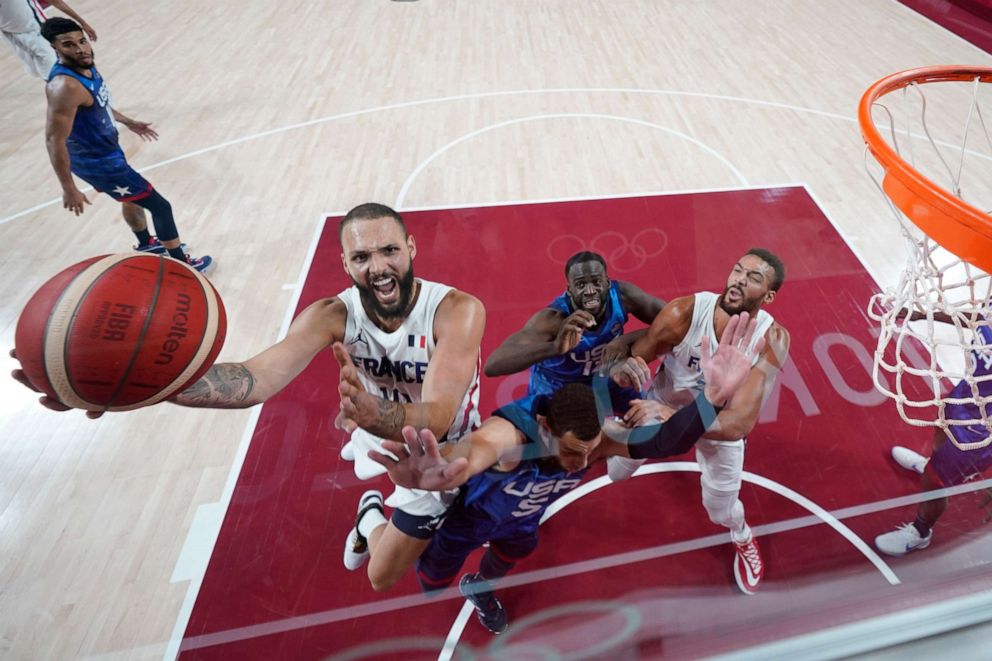 PHOTO: Evan Fournier #10 of Team France drives to the basket against Zachary Lavine #5 of Team United States during the first half of the Men's Preliminary Round Group B game on day two of the Tokyo 2020 Olympic Games.