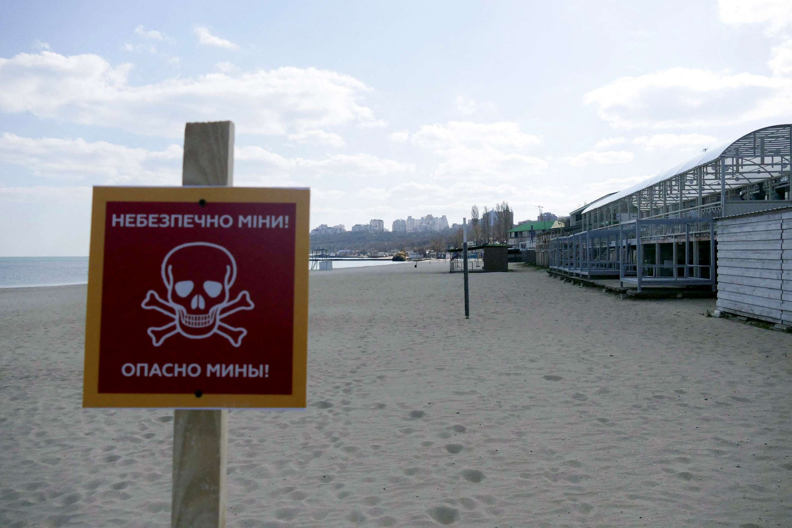 PHOTO: A sign warns beach-goers of potential land mines, in Odessa, Ukraine, April 4, 2022.