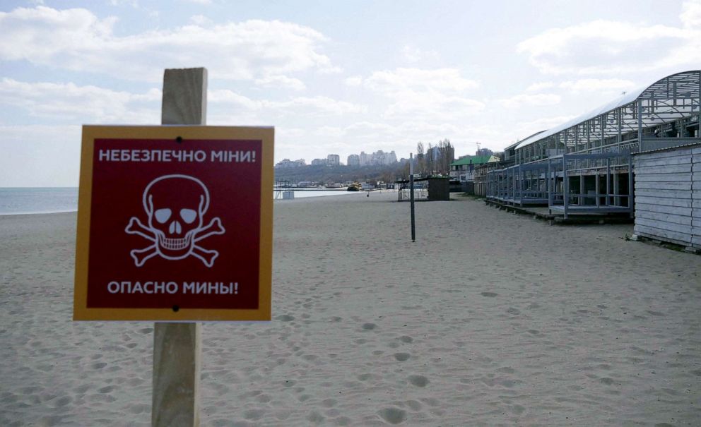 PHOTO: A sign warns beach-goers of potential land mines, in Odessa, Ukraine, April 4, 2022.
