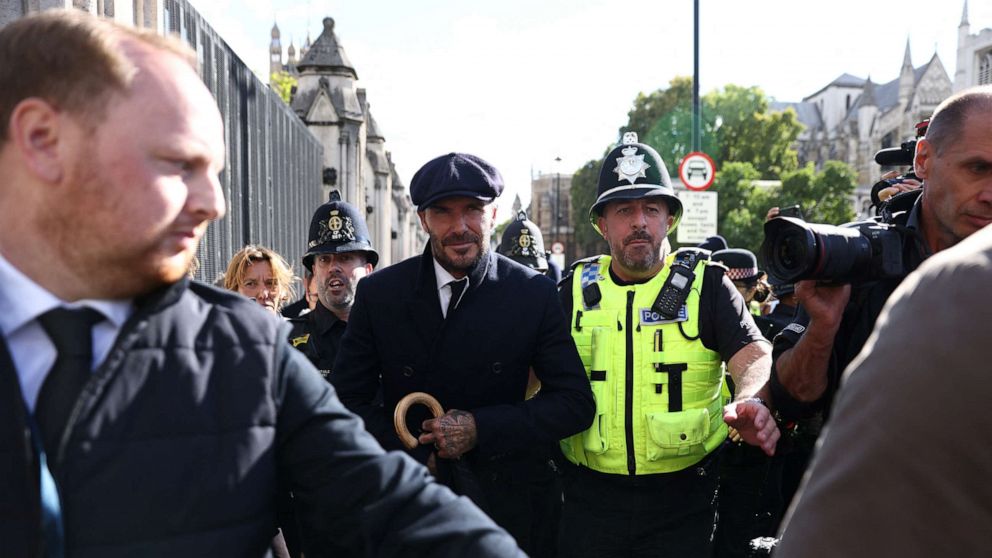 PHOTO: David Beckham leaves after paying his respects to Queen Elizabeth lying in state, following her death, in London, Sept. 16, 2022.