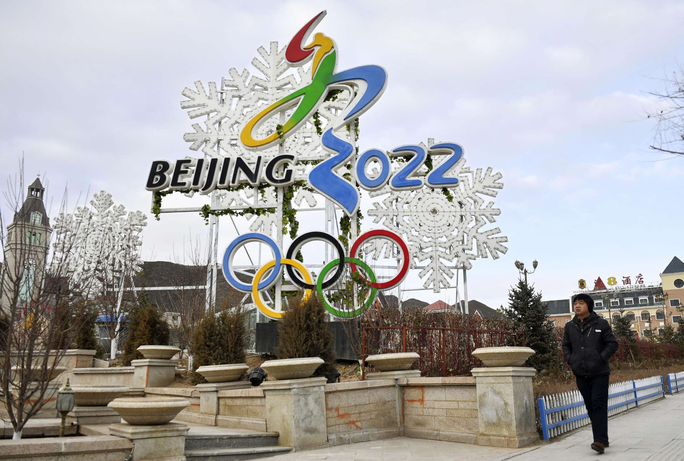 PHOTO: A man walks by a billboard promoting the Beijing Winter Olympics in 2022 in Zhangjiakou, China, Dec. 19, 2017.