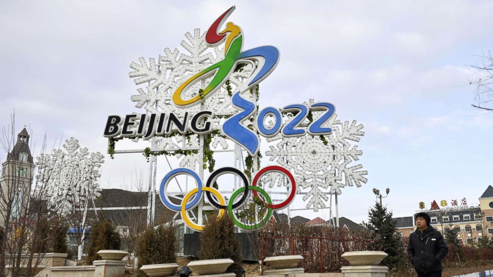 PHOTO: A man walks by a billboard promoting the Beijing Winter Olympics in 2022 in Zhangjiakou, China, Dec. 19, 2017.