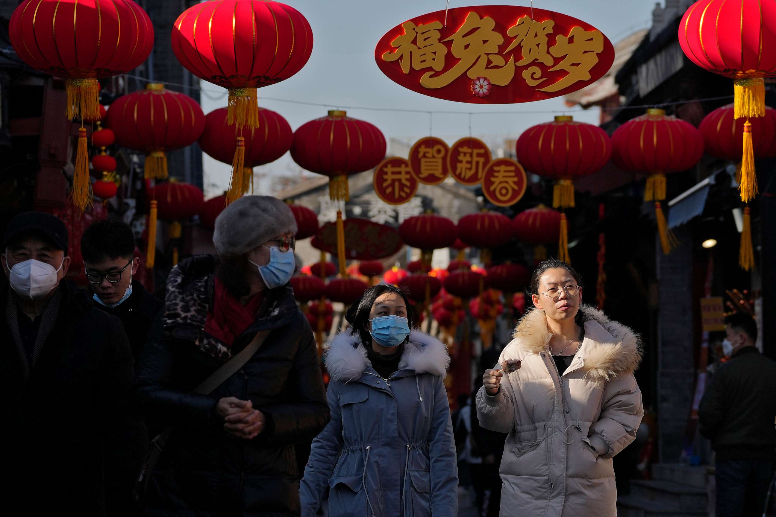 PHOTO: Visitors tour a shopping alley near the Houhai Lake displaying lanterns and Lunar New Year decorations in Beijing, Chin, Jan. 16, 2023.