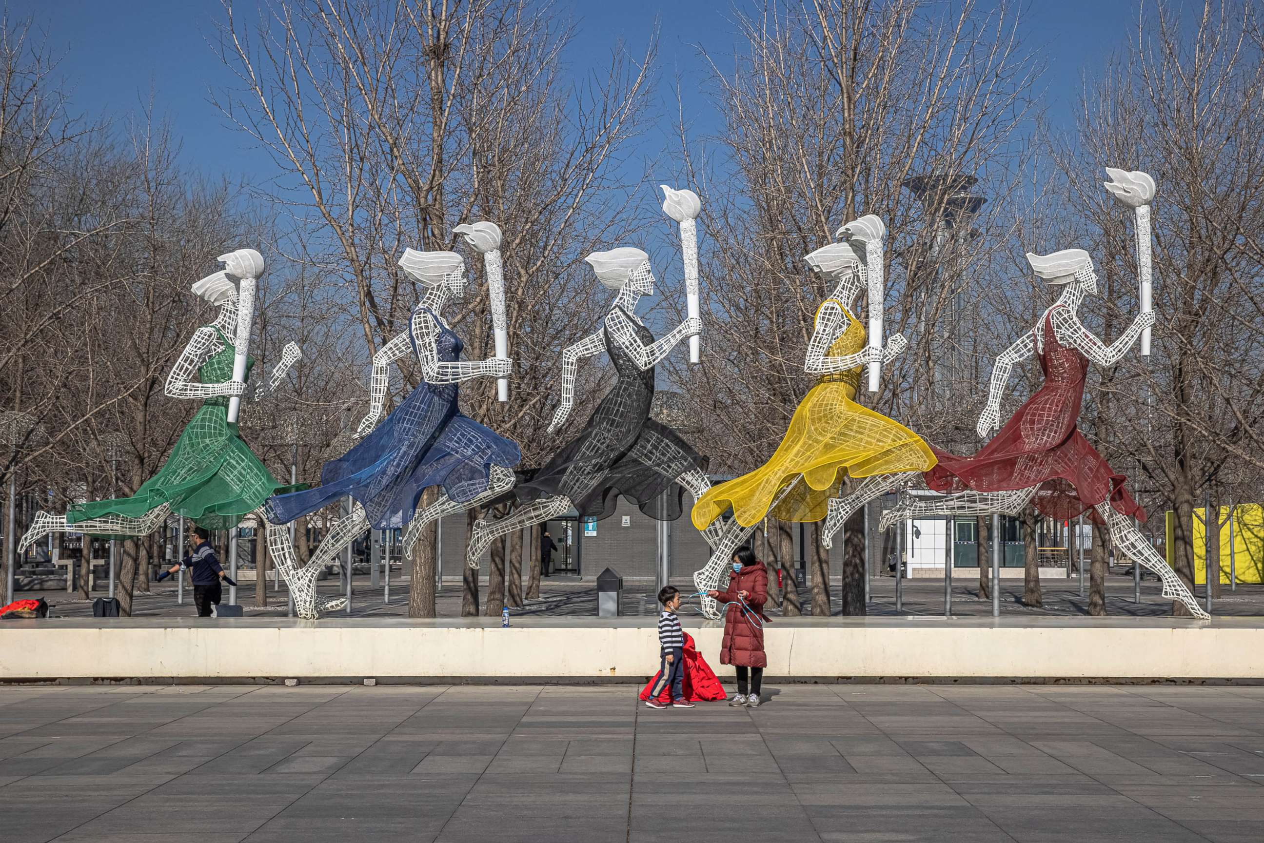 PHOTO: A woman with a young boy visit Beijing Olympic Park 365 days before the 2022 Beijing Winter Olympics, in Beijing, Feb. 4, 2021.