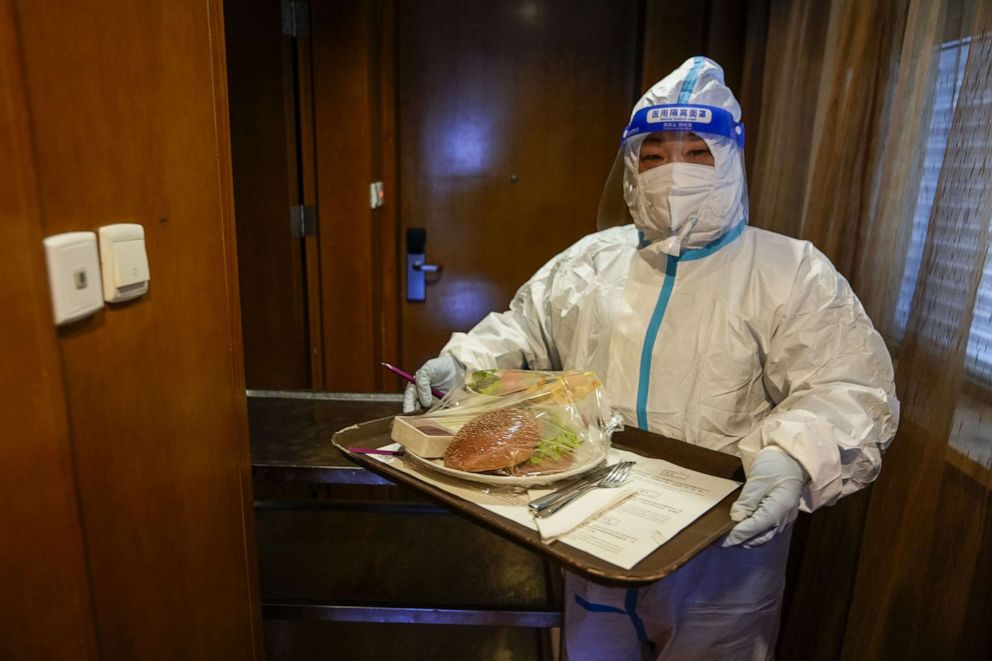 PHOTO: Room service is delivered in a hazmat suit at one of the designated Olympic family hotels inside the Closed Loop system ahead of the Beijing 2022 Winter Olympics on Feb. 2, 2022.
