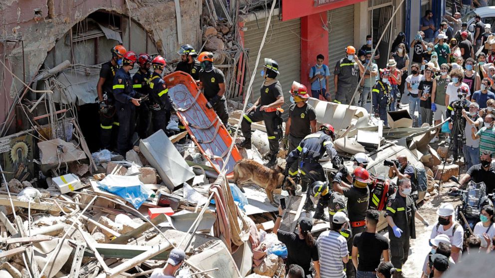 PHOTO: French and Lebanese firemen search in the rubble of a building after the Tuesday explosion at the seaport of Beirut, in Beirut, Lebanon, Aug. 6, 2020.