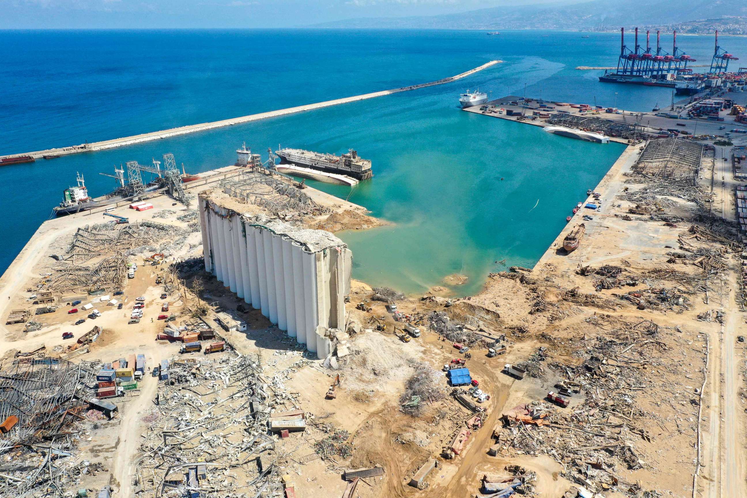 PHOTO: A crater and damaged grain silo are seen from above, Aug. 9, 2020, after an explosion in Beirut's harbor.
