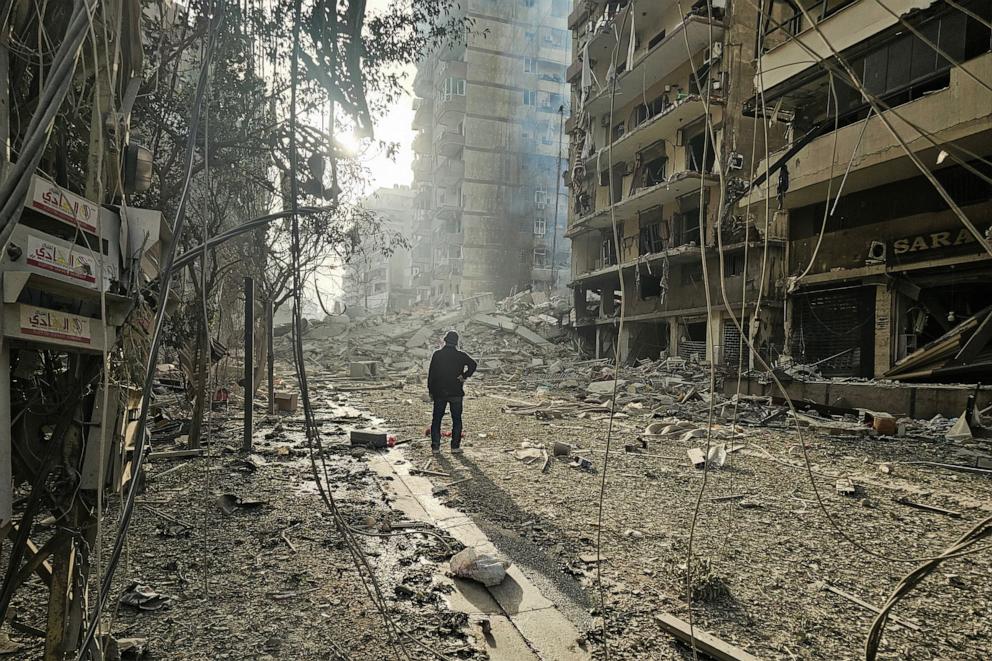 PHOTO: A man looks at the site of overnight Israeli airstrikes in the southern suburbs of Beirut on March 12, 2026. 